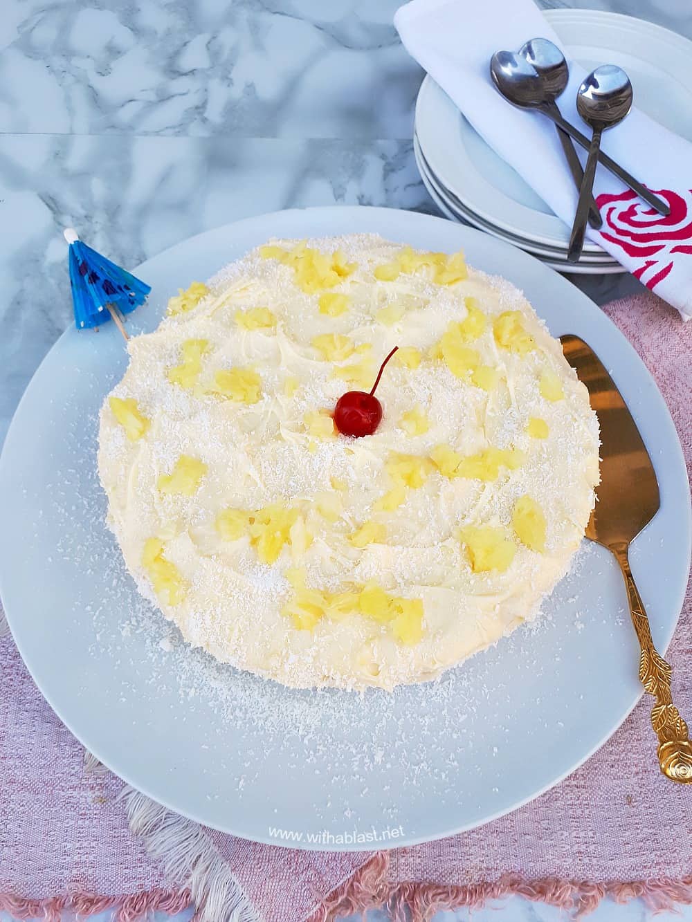 Pina Colada Cake is so soft and moist with an equally delicious frosting - filled with the flavors of the tropical cocktail which just screams Summer !