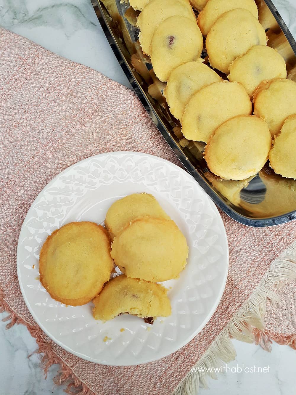 Buttery Shortbread Surprise Cookies have a delicious whole nut chocolate center - pure cookie bliss and you will not be able to stop eating these cookies!