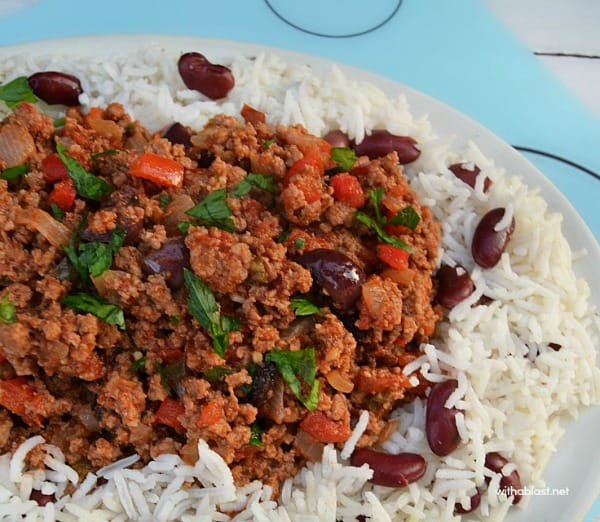 Cuban Picadillo served with a side of Rice and Beans is a quick ground beef, spicy dinner - only 30 minutes from prepping to serving !