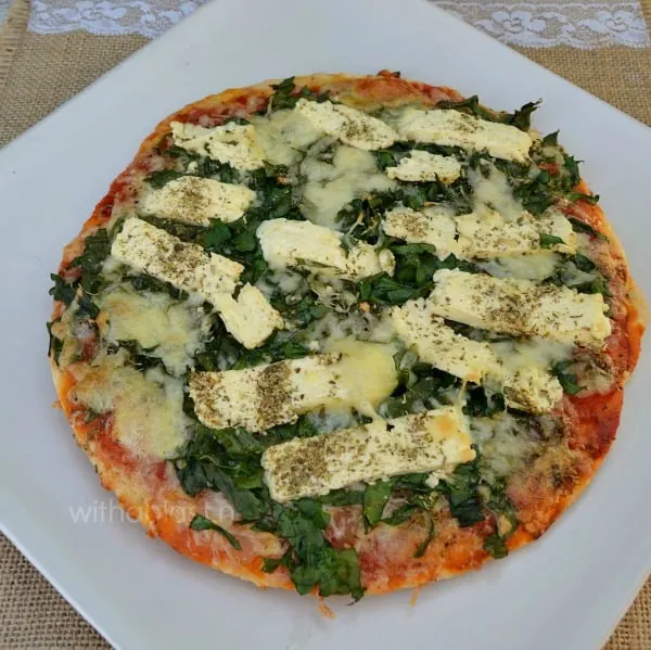 Have this quick and easy Feta and Spinach Pizza for a light meatless Monday dinner - a low-fat version is also given for this popular pizza