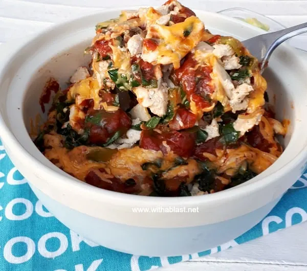 Layers of cheesy, comfort food ! The spinach makes this Chicken Taco Casserole and even non-spinach eaters loves it Chicken Taco Casserole