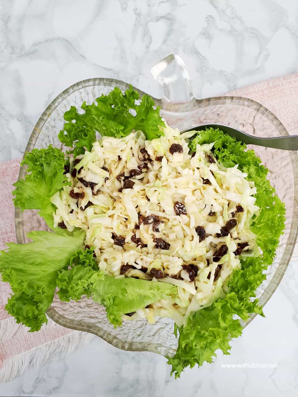 Simple, yet delicious, Cabbage and Onion Salad with raisins is the ideal addition to most main meals and especially good served with barbecued meat