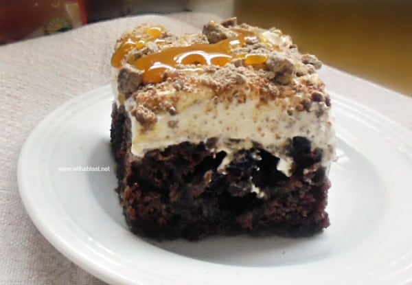 Double Chocolate Toffee Poke Cake is a moist, very chocolatey cake, filled with Toffee sauce and a whipped cream topping AND drizzled with extra sauce !