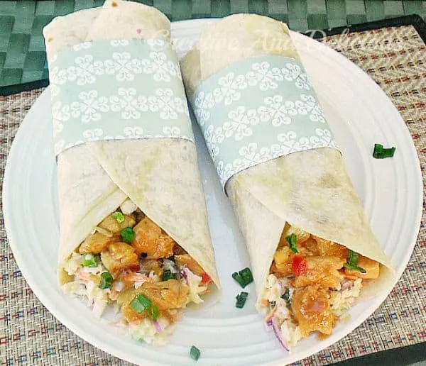 These Sweet Chili Chicken Tortillas with Coleslaw is a delicious, filling light dinner or lunch and is packed with sweet, sour and salty flavors #SweetChiliChicken #ChickenWraps #ColeslawRecipe