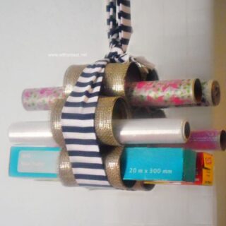 DIY Hanging Wraps Holder ~ Quick and Easy craft ! Use Empty cans to create this handy, hanging holder for all those rolls of wraps.