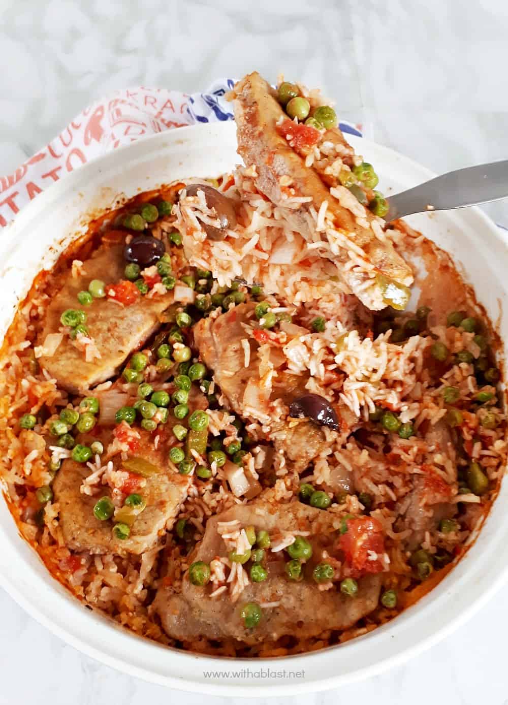 One-Pot Pork Chop and Rice Casserole is an all in one Dinner with tender, juicy Pork Chops, vegetables and tomato rice [easy oven baked recipe]