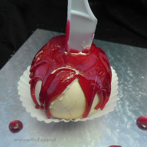 Blood Oozing Chocolate Apples ~ These Apples will have your guests raving for more ! Chocolate covered and drizzled with a quick homemade Hard-Candy {no thermometer needed} #Halloween #CandyApple www.WithABlast.net