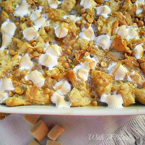 Simply the BEST and EASIEST bread pudding, filled with gooey, saucy deliciousness and topped with S'mores and Chocolate Chips