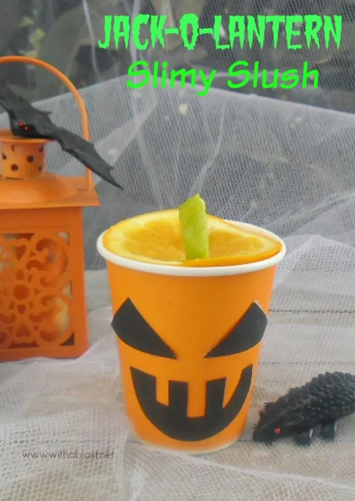 Jack-O-Lantern Slimy Slush is a fun Halloween orange drink - non-alcoholic, quick recipe and easy to make the "Lanterns", using all standard pantry ingredients. #Halloween #HalloweenDrink #JackOLantern www.withablast.net