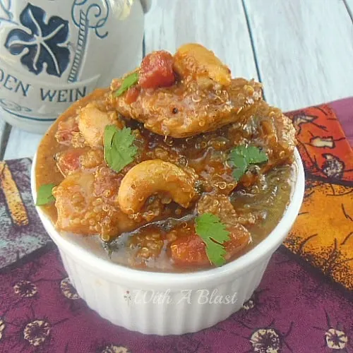 Spicy Chicken with Quinoa is a quick, healthy and easy week night dinner recipe and a dish the kids love too ! Curry paste and tomatoes work so well in this recipe