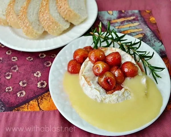Baked Camembert with Honey Roasted Cherries ~ The ultimate in Appetizers ! Soft, gooey cheese topped with caramelized Honey roasted Cherries