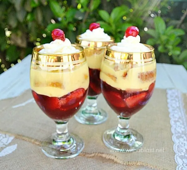 Strawberry Liqueur Trifles ~ Boozy Jello made from fresh Fruit Juice, combined with Custard, Strawberries, Swiss Roll slices and topped with Cream and a Cherry make these Individual {or one huge!} trifles a winner each and every time!