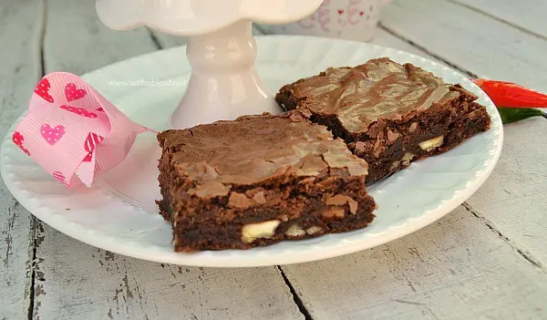 These , gooey Decadent Chili Chocolate Brownies have a spicy bite to them and make the perfect Valentines Day treat ( or any other day ! ).