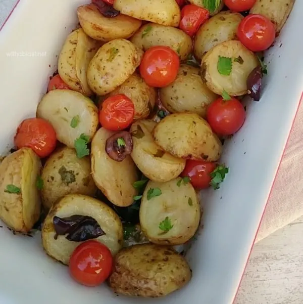 Mediterranean Baby Potatoes is bursting with the taste of the Mediterranean - bring this to your home with this scrumptious, easy Baby Potato dish ! #SideDish #PotatoRecipe #Potatoes #MediterraneanPotatoes #Thanksgiving #Christmas