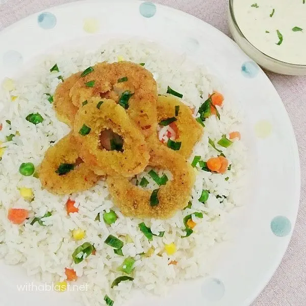 Delicious crumbed Calamari, served over Vegetable Rice and a Garlic-Lemon Dip on the side. Complete meal in no time at all !