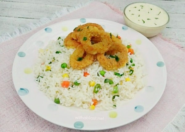 Delicious crumbed Calamari, served over Vegetable Rice and a Garlic-Lemon Dip on the side. Complete meal in no time at all !