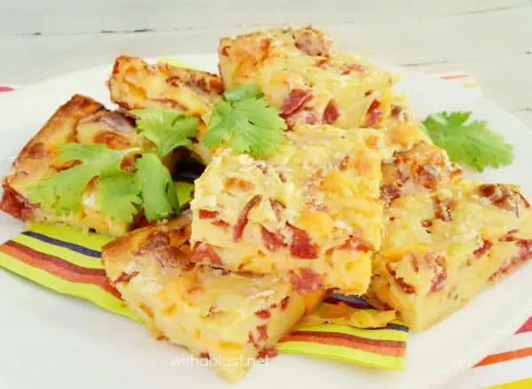 Cheesy Pepperoni Bars are serious snacking stuff ! Gooey, crunchy and tastes like a slice of Pizza and leftovers are perfect for the lunchbox. Cheesy Pepperoni Bars are serious snacking stuff ! Gooey, crunchy and tastes like a slice of Pizza and leftovers are perfect for the lunchbox.