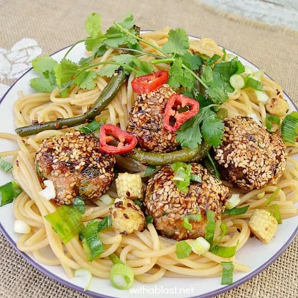 These Sesame Pork Meatballs are bursting with flavor and only takes a few minutes to make {make-ahead friendly recipe as well!} - serve on a busy weeknight for dinner, an appetizer or as a snack with a dipping sauce Sesame Pork Meatballs