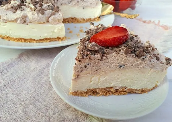 This No-Bake Cheesecake had my family raving ! Crust, Cheesecake layer, Chocolate Mousse and more Chocolate !