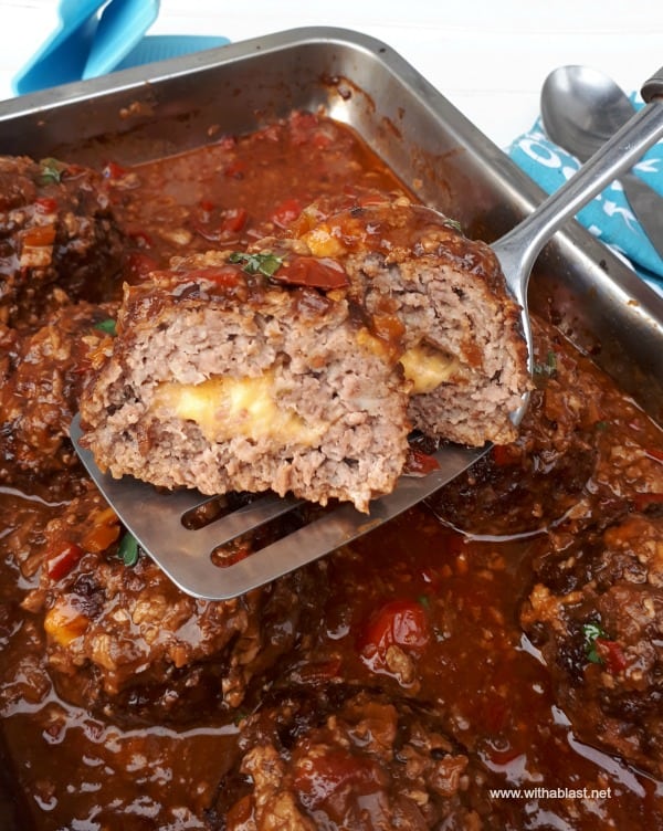 Mountain Meatballs are giant, stuffed with Cheddar Cheese meatballs, nestled in a rich, tasty sauce make the most delicious comfort dinner