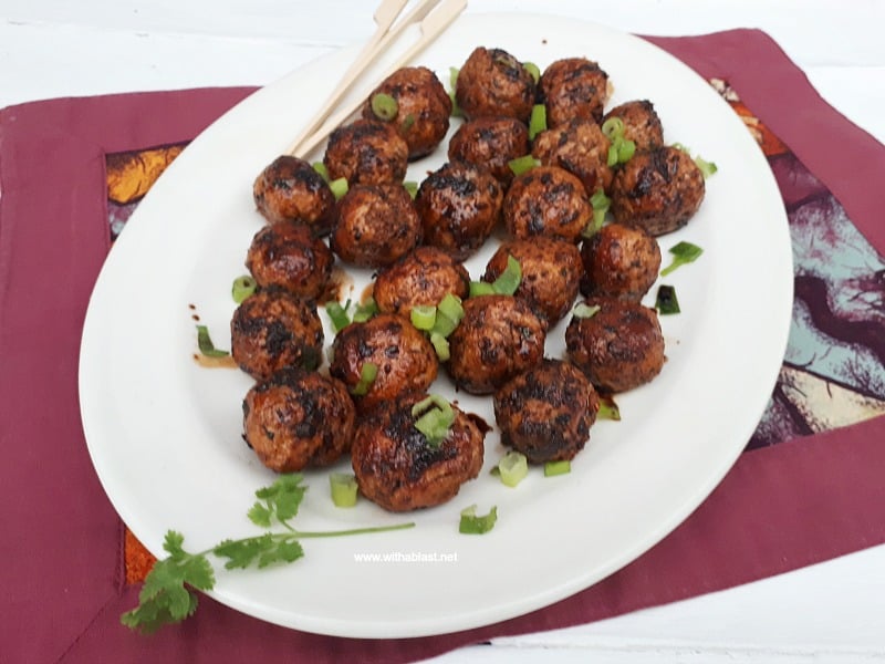 Slightly spicy, juicy Asian Chicken Meatballs, with a salty/sweet glaze are perfect to serve as an appetizer or as part of your savory party platter - make-ahead friendly recipe