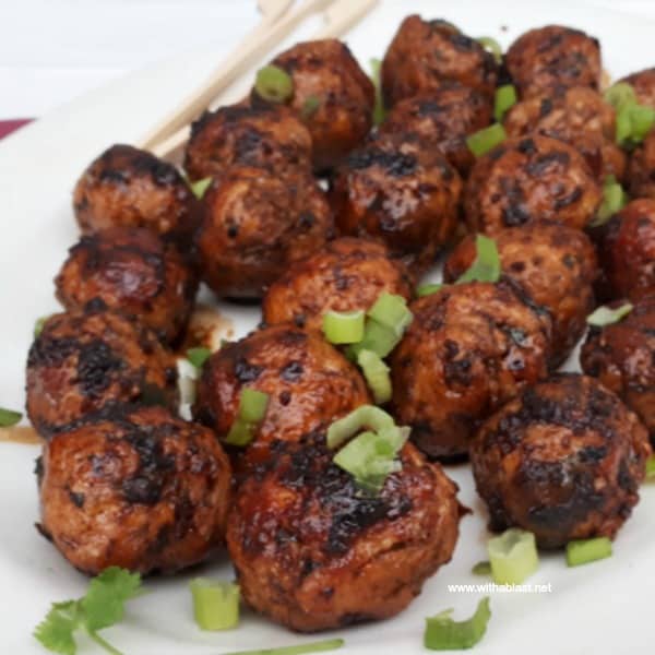 Slightly spicy, juicy Asian Chicken Meatballs, with a salty/sweet glaze are perfect to serve as an appetizer or as part of your savory party platter - make-ahead friendly recipe