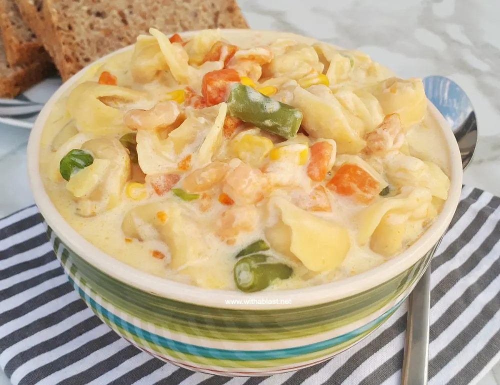 Creamy Shrimp Tortellini Soup is packed with vegetables, so filling and so comforting - ready in about 30 minutes Creamy Shrimp Tortellini Soup