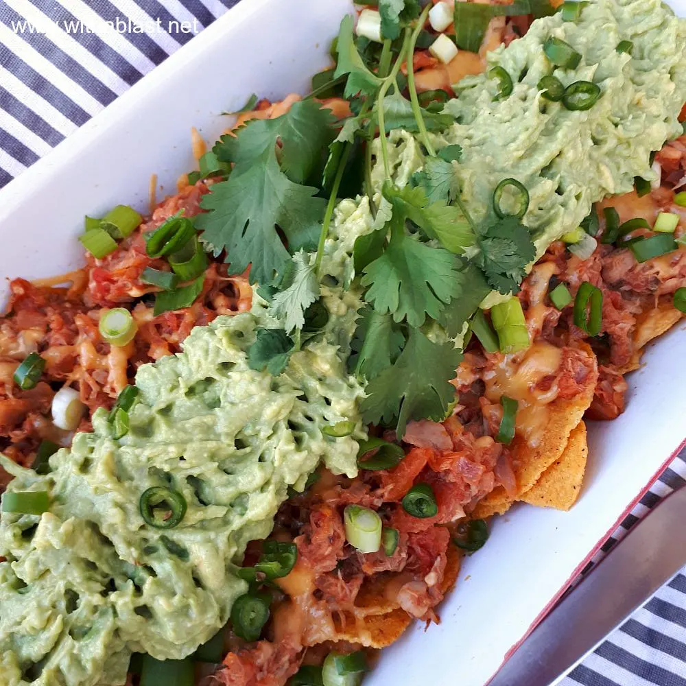 Quick Tuna melt Nachos is a cheesy, tomato rich, quick and easy dish to be served as an appetizer, snack and perfect as a light dinner too