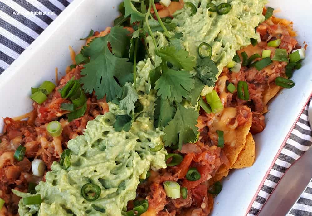 Quick Tuna melt Nachos is a cheesy, tomato rich, quick and easy dish to be served as an appetizer, snack and perfect as a light dinner too