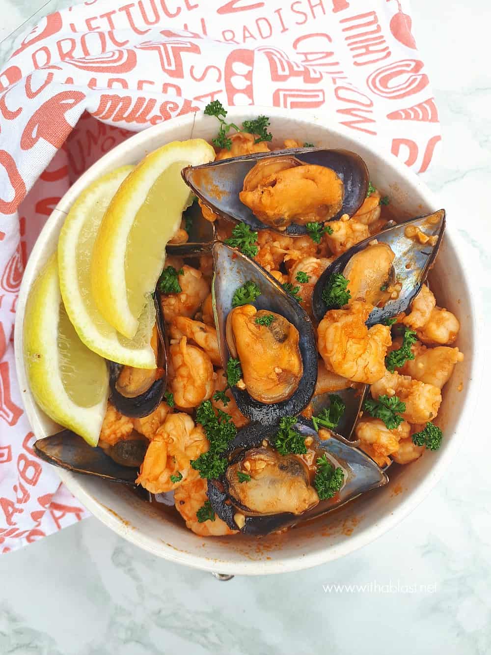 Red Prawns and Mussels are slightly spicy and nestled in a creamy paprika tomato sauce - so quick and easy to serve for dinner or as an appetizer