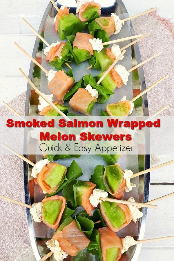 Smoked Salmon Wrapped Melon Skewers are quick and easy to make. Dill Mascarpone and Arugula complete this very tasty, elegant appetizer #Appetizer #SalmonRecipes #SeafoodRecipes #SalmonAppetizer #NewYearsEveSnacks