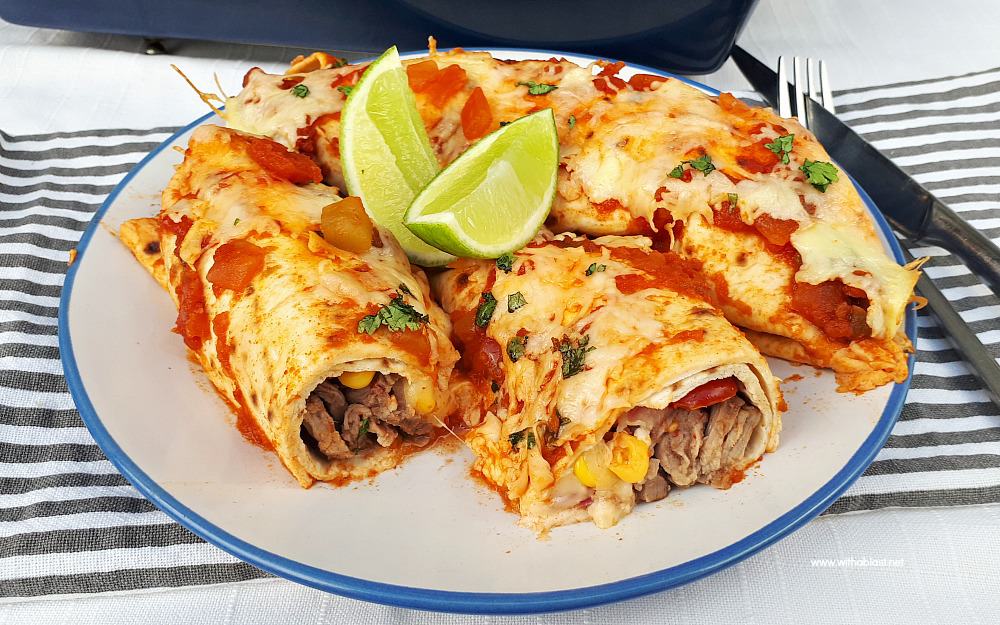 Perfectly marinated Tequila Lime Steak Enchiladas are loaded with steak, a delicious salsa, cheese and topped with chunky salsa sauce and more cheese !