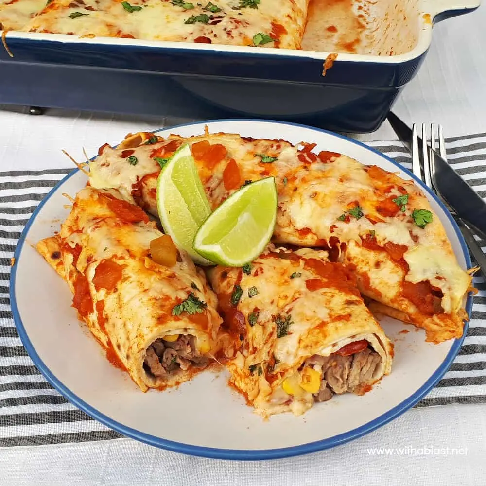 Perfectly marinated Tequila Lime Steak Enchiladas are loaded with steak, a delicious salsa, cheese and topped with chunky salsa sauce and more cheese !