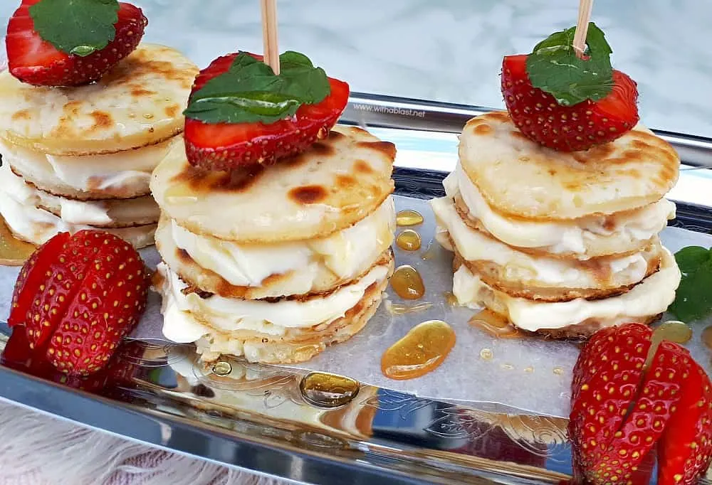 Deliciously Mascarpone Filled Mini Pancakes Stacks are perfect for a special breakfast, brunch or even a sweet treat. Perfect with Strawberries and drizzled with Honey! Deliciously Mascarpone Filled Mini Pancakes Stacks are perfect for a special breakfast, brunch or even a sweet treat. Perfect with Strawberries and drizzled with Honey!