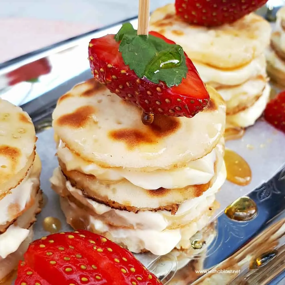 Deliciously Mascarpone Filled Mini Pancakes Stacks are perfect for a special breakfast, brunch or even a sweet treat. Perfect with Strawberries and drizzled with Honey! #PancakeStacks #MiniPancakes #FilledPancakes #BreakfastRecipes #SweetTreatRecipes