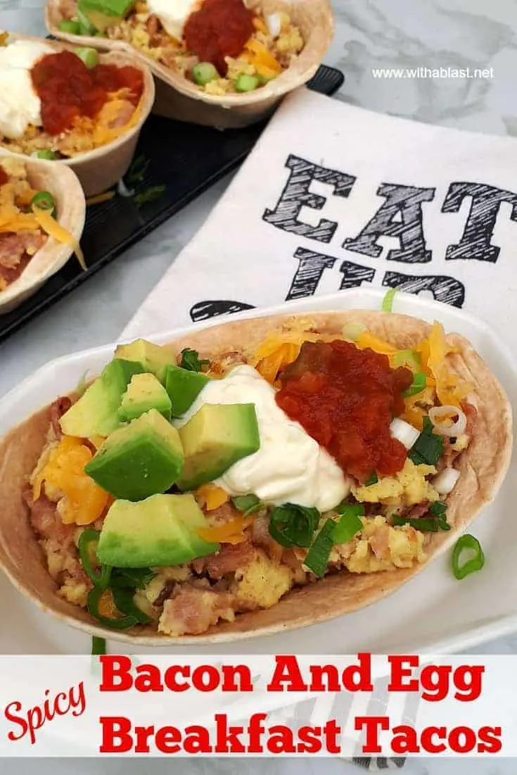 So quick ! Deliciously spicy filled Bacon and Egg Breakfast Tacos with all the trimmings !