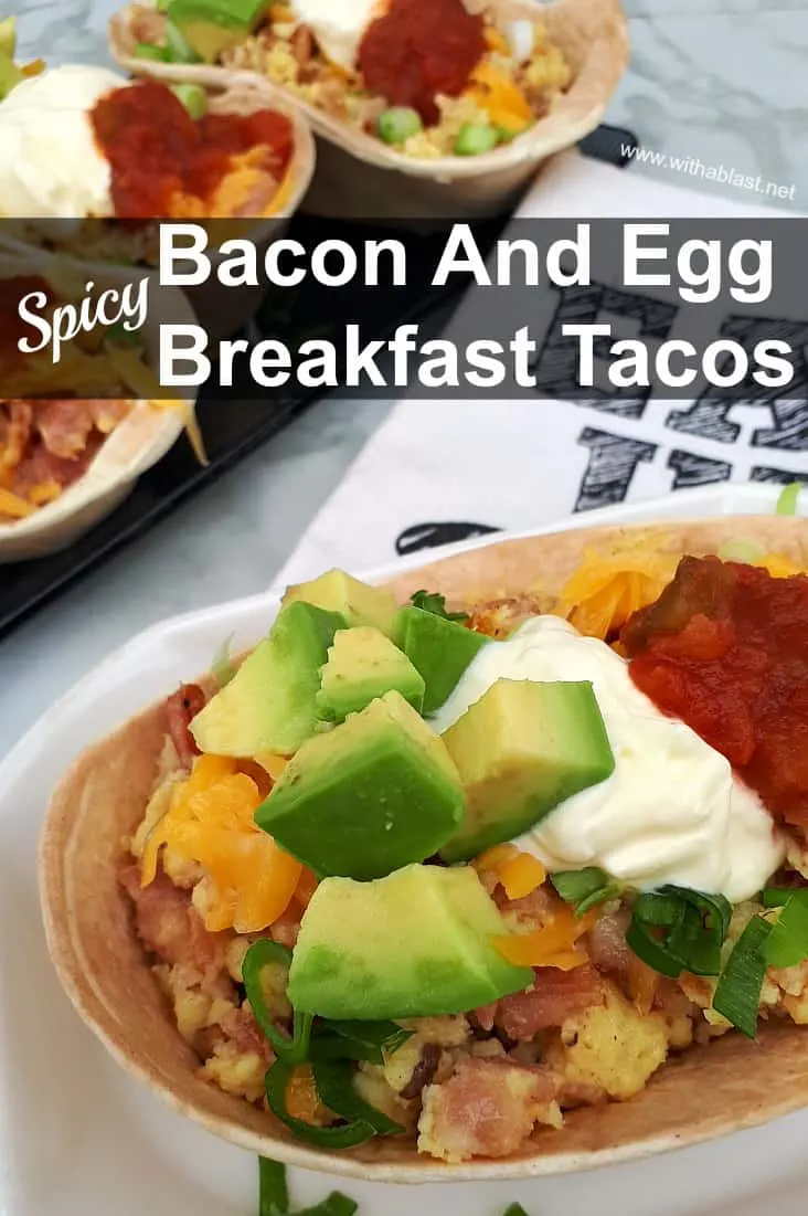 So quick ! Deliciously spicy filled Bacon and Egg Breakfast Tacos with all the trimmings !